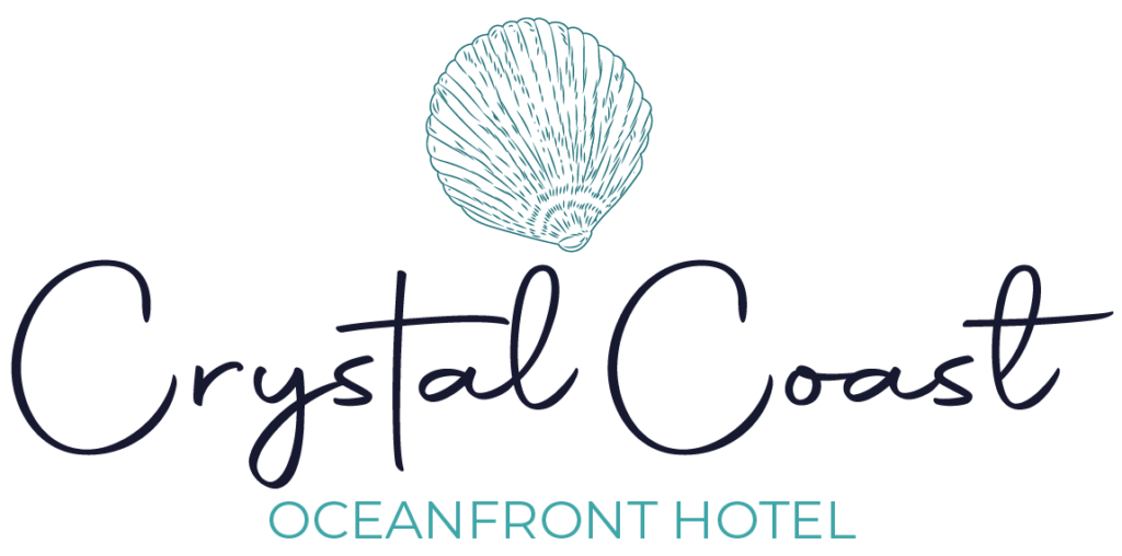 green seashell above the words 'crystal coast oceanfront hotel '